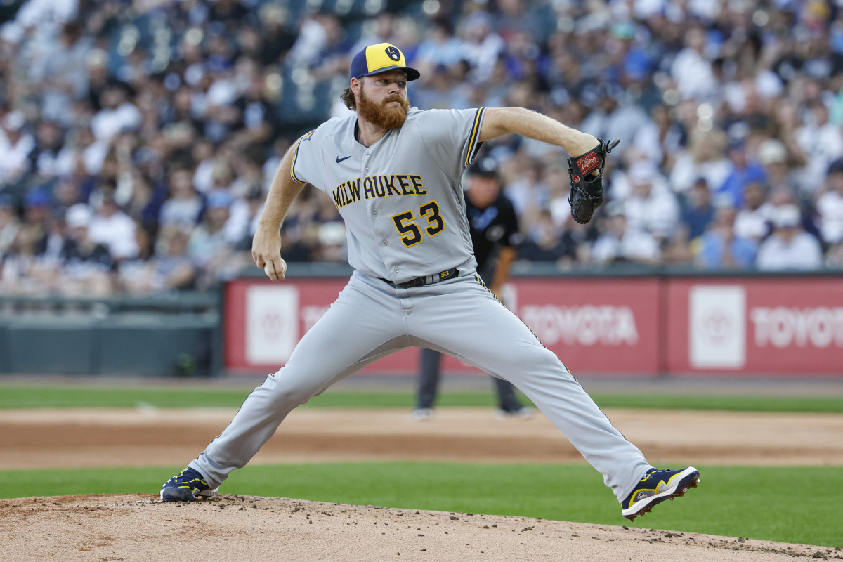 Brandon Woodruff brings his arm back holding the baseball to pitch